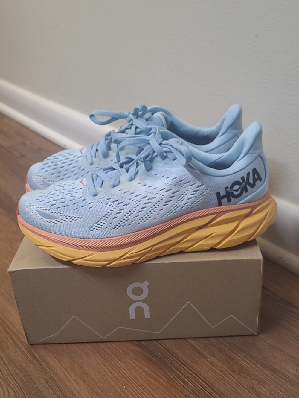 Hoka Women's Athletic Shoes in Light Blue with Yellow and Peach Accents